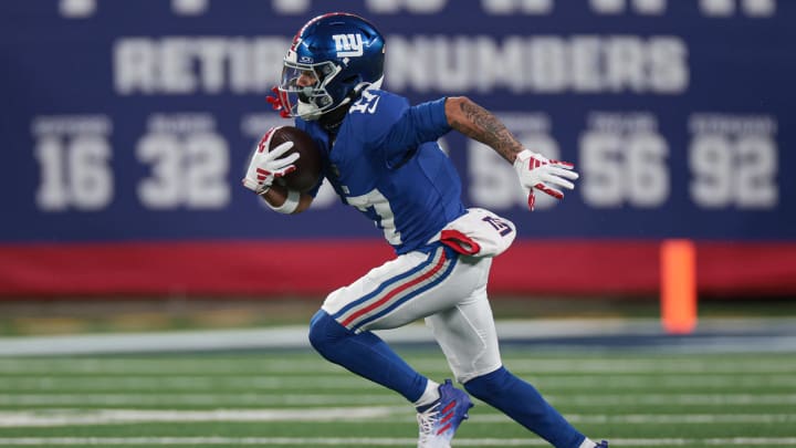 Jan 7, 2024; East Rutherford, New Jersey, USA; New York Giants wide receiver Wan'Dale Robinson (17) gains yards after catch against the Philadelphia Eagles during the first quarter at MetLife Stadium. Mandatory Credit: Vincent Carchietta-USA TODAY Sports
