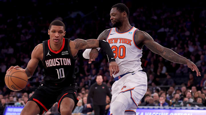 Jan 17, 2024; New York, New York, USA; Houston Rockets forward Jabari Smith Jr. (10) controls the ball against New York Knicks forward Julius Randle (30) during the fourth quarter at Madison Square Garden. Mandatory Credit: Brad Penner-Imagn Images