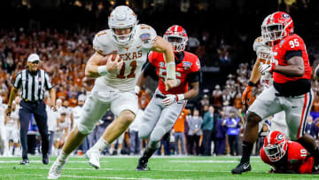 Jan 1, 2019; New Orleans, LA, USA;  Texas Longhorns quarterback Sam Ehlinger (11) scrambles for a touchdown against Georgia.