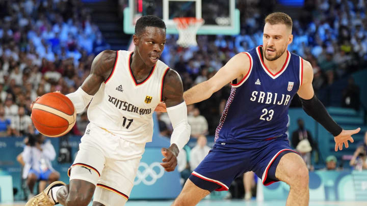 Aug 10, 2024; Paris, France; Germany point guard Dennis Schroder (17) dribbles the ball against Serbia shooting guard Marko Guduric (23) in the men's basketball bronze medal game during the Paris 2024 Olympic Summer Games at Accor Arena. Mandatory Credit: Rob Schumacher-USA TODAY Sports