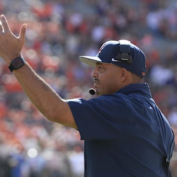 Oct 19, 2024; Clemson, South Carolina, USA; Virginia Cavaliers head coach Tony Elliott on the field gestures during the game against the Clemson Tigers at Memorial Stadium. Mandatory Credit: Alexander Hicks-Imagn Images