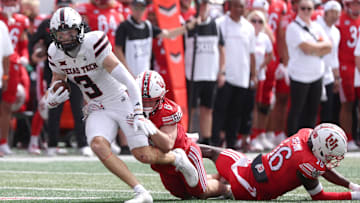 Sep 20, 2025; Salt Lake City, Utah, USA; Texas Tech Red Raiders wide receiver Coy Eakin (3) runs after a catch against Utah Utes cornerback Elijah Davis (9) and cornerback Blake Cotton (16) during the fourth quarter at Rice-Eccles Stadium. Mandatory Credit: Rob Gray-Imagn Images