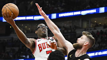 Mar 4, 2025; Chicago, Illinois, USA;  Chicago Bulls forward Jalen Smith (7) shoots past Cleveland Cavaliers forward Dean Wade (32) during the first half at United Center. Mandatory Credit: Matt Marton-Imagn Images