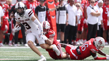 Sep 20, 2025; Salt Lake City, Utah, USA; Texas Tech Red Raiders wide receiver Coy Eakin (3) runs after a catch against Utah Utes cornerback Elijah Davis (9) and cornerback Blake Cotton (16) during the fourth quarter at Rice-Eccles Stadium. Mandatory Credit: Rob Gray-Imagn Images