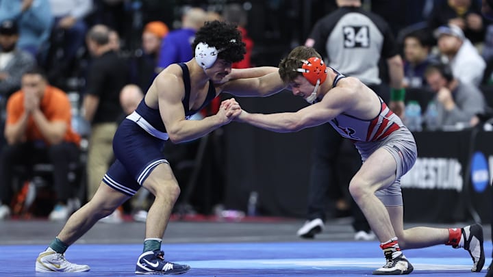 Penn State's Beau Bartlett wrestles CJ Composto of Penn during the quarterfinals of the NCAA Wrestling Championships at Wells Fargo Center. Penn State's Beau Bartlett wrestles CJ Composto of Penn during the quarterfinals of the NCAA Wrestling Championships at Wells Fargo Center.