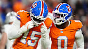 Nov 6, 2025; Denver, Colorado, USA; Denver Broncos linebacker Nik Bonitto (15) and linebacker Jonathon Cooper (0) react during the first half at Empower Field at Mile High. 