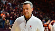 Departing Virginia Cavaliers head coach Tony Bennett walks off the court in February.