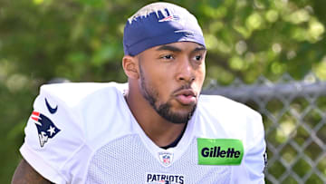 Jul 28, 2025; Foxborough, MA, USA; New England Patriots running back TreVeyon Henderson (32) heads to the practice fields for training camp at Gillette Stadium. Mandatory Credit: Eric Canha-Imagn Images