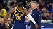 Jan 25, 2024; San Francisco, California, USA; Golden State Warriors forward Jonathan Kuminga (00) reacts after a foul with head coach Steve Kerr against the Sacramento Kings during the second quarter at Chase Center. Mandatory Credit: D. Ross Cameron-Imagn Images