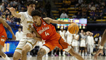 Jan 11, 2025; Berkeley, California, USA; Virginia Tech Hokies guard Rodney Brown Jr. (4) dribbles the ball against California Golden Bears guard Andrej Stojakovic (2) during the second half at Haas Pavilion. Mandatory Credit: D. Ross Cameron-Imagn Images