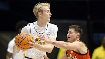 Jan 11, 2025; Berkeley, California, USA; (Editors Notes: Caption Correction) California Golden Bears forward Rytis Petraitis (31) controls the ball against Virginia Tech Hokies guard Brandon Rechsteiner (7) during the first half at Haas Pavilion. Mandatory Credit: D. Ross Cameron-Imagn Images