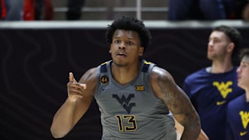 Mar 4, 2025; Salt Lake City, Utah, USA; West Virginia Mountaineers forward Amani Hansberry (13) reacts to a shot against the Utah Utes during the second half at Jon M. Huntsman Center. Mandatory Credit: Rob Gray-Imagn Images
