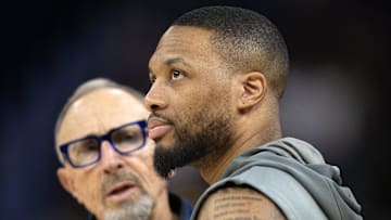 Mar 18, 2025; San Francisco, California, USA; Milwaukee Bucks guard Damian Lillard (right) chats up Golden State Warriors assistant coach Ron Adams before a game at Chase Center. Mandatory Credit: D. Ross Cameron-Imagn Images