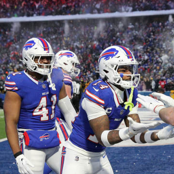 Buffalo Bills wide receiver Stefon Diggs (14) celebrates Buffalo Bills tight end Dalton Kincaid   s (86) touchdown.