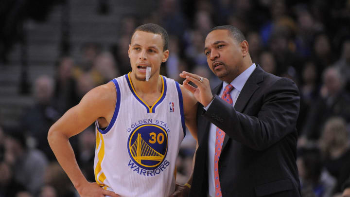 January 11, 2013; Oakland, CA, USA; Golden State Warriors head coach Mark Jackson (right) instructs point guard Stephen Curry (30) during the second quarter against the Portland Trail Blazers at Oracle Arena. Mandatory Credit: Kyle Terada-USA TODAY Sports