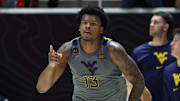 Mar 4, 2025; Salt Lake City, Utah, USA; West Virginia Mountaineers forward Amani Hansberry (13) reacts to a shot against the Utah Utes during the second half at Jon M. Huntsman Center. Mandatory Credit: Rob Gray-Imagn Images