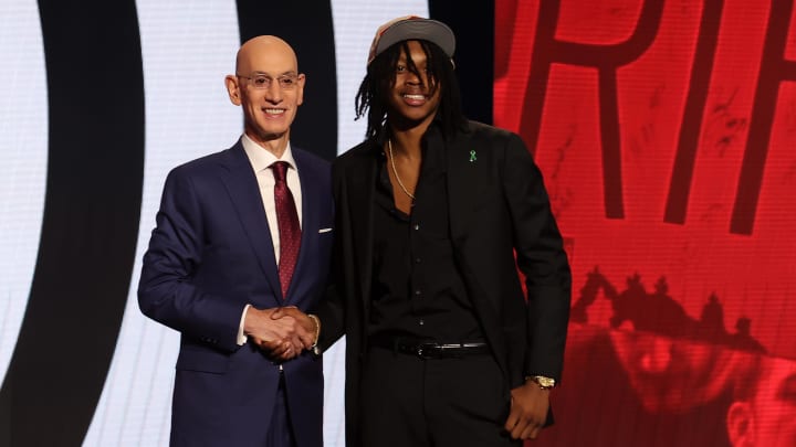 Jun 26, 2024; Brooklyn, NY, USA; Carlton Carrington poses for photos with NBA commissioner Adam Silver after being selected in the first round by the Portland Train Blazers in the 2024 NBA Draft at Barclays Center. Mandatory Credit: Brad Penner-USA TODAY Sports