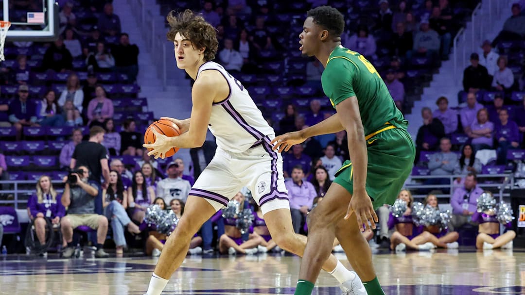 Feb 17, 2026; Manhattan, Kansas, USA; Kansas State Wildcats center Dorin Buca (22) is guarded by Baylor Bears center James Nnaji (46) during the first half at Bramlage Coliseum. Mandatory Credit: Scott Sewell-Imagn Images