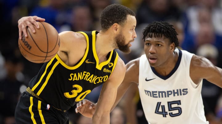 Mar 20, 2024; San Francisco, California, USA; Golden State Warriors guard Stephen Curry (30) looks to drive around Memphis Grizzlies forward GG Jackson II (45) during the third quarter at Chase Center. Mandatory Credit: D. Ross Cameron-USA TODAY Sports