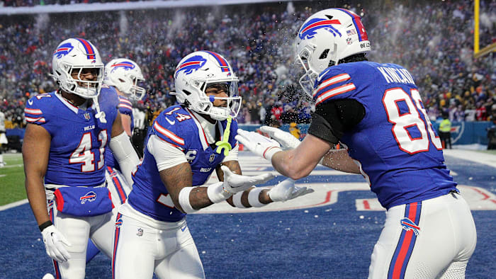 Buffalo Bills wide receiver Stefon Diggs (14) celebrates Buffalo Bills tight end Dalton Kincaid   s