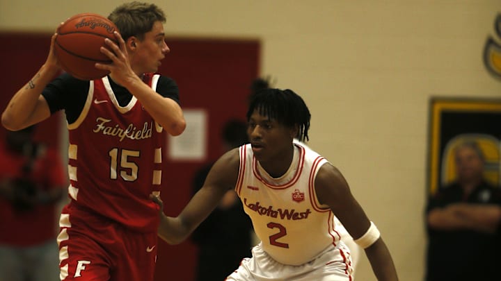 Lakota West junior Josh Tyson (2) guards Fairfield senior Riley Cunningham (15) as Lakota West defeated Fairfield, 58-41 in OHSAA boys basketball Jan. 9, 2026 at Lakota West.