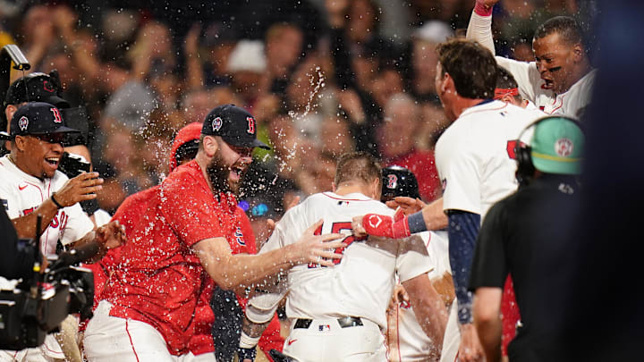 Sep 11, 2024; Boston, Massachusetts, USA; Boston Red Sox left fielder Tyler O'Neill (17) his a three run home run to win the game against the Baltimore Orioles in ten innings at Fenway Park. Mandatory Credit: David Butler II-Imagn Images