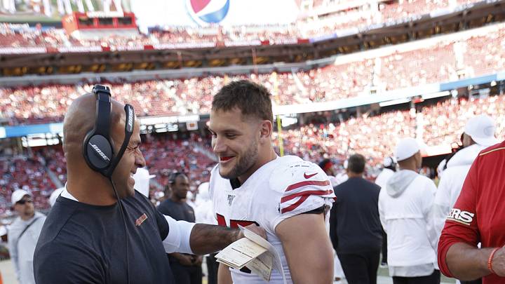 San Francisco 49ers defensive coordinator Robert Saleh (L) and defensive end Nick Bosa (R)