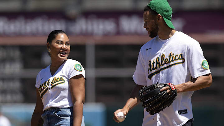 Golden State Warriors star Stephen Curry (right) and his wife Ayesha throw out the ceremonial first pitch before a game between the Oakland Athletics and Houston Astros. Golden State Warriors star Stephen Curry (right) and his wife Ayesha throw out the ceremonial first pitch before a game between the Oakland Athletics and Houston Astros.