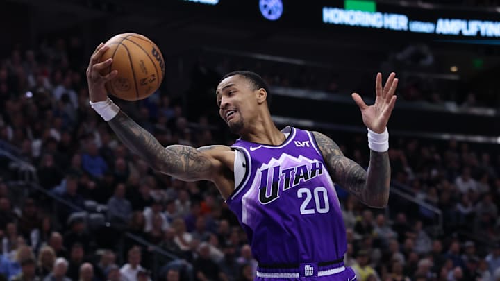 Mar 25, 2024; Salt Lake City, Utah, USA; Utah Jazz forward John Collins (20) rebounds against the Dallas Mavericks during the second quarter at Delta Center. Mandatory Credit: Rob Gray-Imagn Images