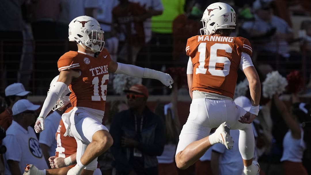 Nov 22, 2025; Austin, Texas, USA; Texas Longhorns quarterback Arch Manning (16) and defensive back Michael Taaffe (16) react after a touchdown during the first half against the Arkansas Razorbacks at Darrell K Royal-Texas Memorial Stadium. Mandatory Credit: Scott Wachter-Imagn Images Nov 22, 2025; Austin, Texas, USA; Texas Longhorns quarterback Arch Manning (16) and defensive back Michael Taaffe (16) react after a touchdown during the first half against the Arkansas Razorbacks at Darrell K Royal-Texas Memorial Stadium. Mandatory Credit: Scott Wachter-Imagn Images