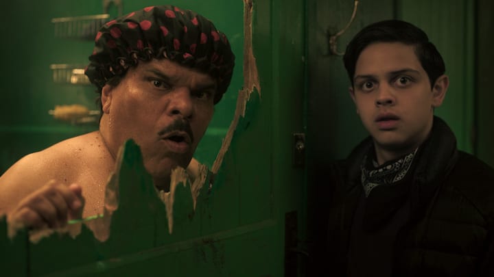 (L to R) Luis Guzmán as Gomez Addams, Isaac Ordonez as Pugsley Addams in episode 203 of Wednesday