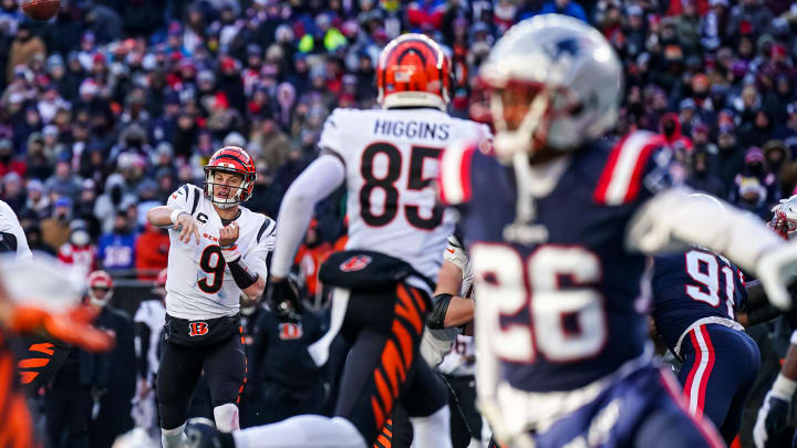 Dec 24, 2022; Foxborough, Massachusetts, USA; Cincinnati Bengals quarterback Joe Burrow (9) throws a touchdown pass to wide receiver Trenton Irwin (16) against the New England Patriots in the first half at Gillette Stadium. Mandatory Credit: David Butler II-USA TODAY Sports