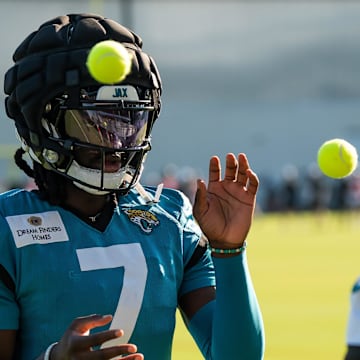 Jacksonville Jaguars wide receiver Brian Thomas Jr. (7) and Jacksonville Jaguars wide receiver Travis Hunter (12) use tennis balls in a drill during an NFL training camp fourth session at the Miller Electric Center, Sunday, July 27, 2025, in Jacksonville, Fla. [Doug Engle/Florida Times-Union]