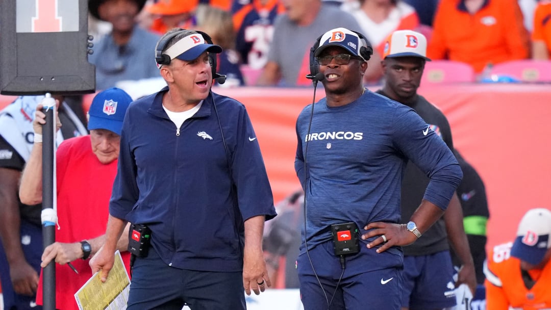 Denver Broncos Sean Peyton talks to defensive coordinator Vance Joseph following a first down reception by the New York Jets in the fourth quarter at Empower Field at Mile High. 