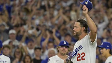 Los Angeles Dodgers starting pitcher Clayton Kershaw (22) tips his cap while walking off the field after throwing the 3000th strikeout pitch to end the sixth inning against the Chicago White Sox at Dodger Stadium on July 2.