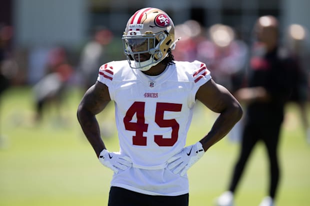 San Francisco 49ers third-round draft pick Nick Martin (45) works out with his teammates during the teamís rookie minicamp. M
