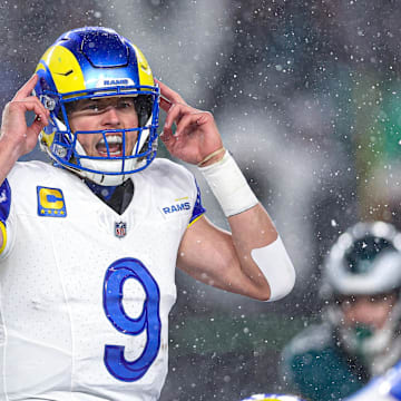 Jan 19, 2025; Philadelphia, Pennsylvania, USA; Los Angeles Rams quarterback Matthew Stafford (9) calls a play at the one of scrimmage against the Philadelphia Eagles in a 2025 NFC divisional round game at Lincoln Financial Field. Mandatory Credit: Bill Streicher-Imagn Images