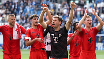 Bayern Munich players celebrate with fans after a 4-0 win against Hoffenheim on the final matchday of the Bundesliga.