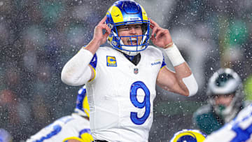 Jan 19, 2025; Philadelphia, Pennsylvania, USA; Los Angeles Rams quarterback Matthew Stafford (9) calls a play at the one of scrimmage against the Philadelphia Eagles in a 2025 NFC divisional round game at Lincoln Financial Field. Mandatory Credit: Bill Streicher-Imagn Images