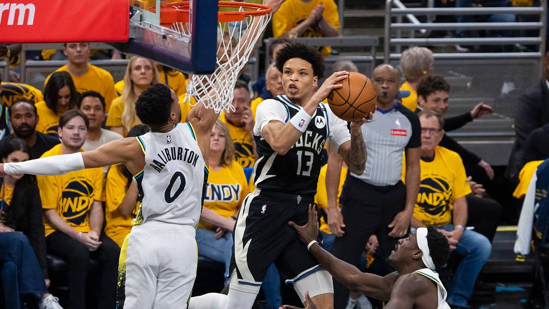 Apr 19, 2025; Indianapolis, Indiana, USA; Milwaukee Bucks guard Ryan Rollins (13) shoots the ball while Indiana Pacers guard Tyrese Haliburton (0) defends in the first half at Gainbridge Fieldhouse. Mandatory Credit: Trevor Ruszkowski-Imagn Images Apr 19, 2025; Indianapolis, Indiana, USA; Milwaukee Bucks guard Ryan Rollins (13) shoots the ball while Indiana Pacers guard Tyrese Haliburton (0) defends in the first half at Gainbridge Fieldhouse. Mandatory Credit: Trevor Ruszkowski-Imagn Images
