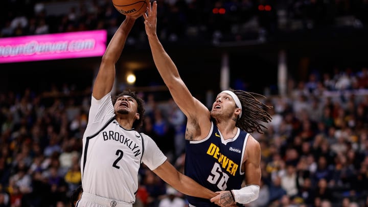 Dec 14, 2023; Denver, Colorado, USA; Brooklyn Nets forward Cam Johnson (2) and Denver Nuggets forward Aaron Gordon (50) battle for the ball in the third quarter at Ball Arena. Mandatory Credit: Isaiah J. Downing-USA TODAY Sports
