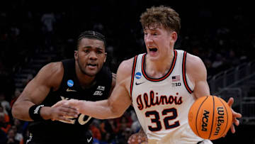 Illinois guard Kasparas Jakucionis (32) drives up to the basket as Xavier guard Dayvion McKnight (20) attempts to guard him during the second half of their first round NCAA men’ s basketball tournament game on Friday March 21, 2025 at Fiserv Forum in Milwaukee, Wis.