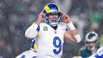Jan 19, 2025; Philadelphia, Pennsylvania, USA; Los Angeles Rams quarterback Matthew Stafford (9) calls a play at the one of scrimmage against the Philadelphia Eagles in a 2025 NFC divisional round game at Lincoln Financial Field. Mandatory Credit: Bill Streicher-Imagn Images