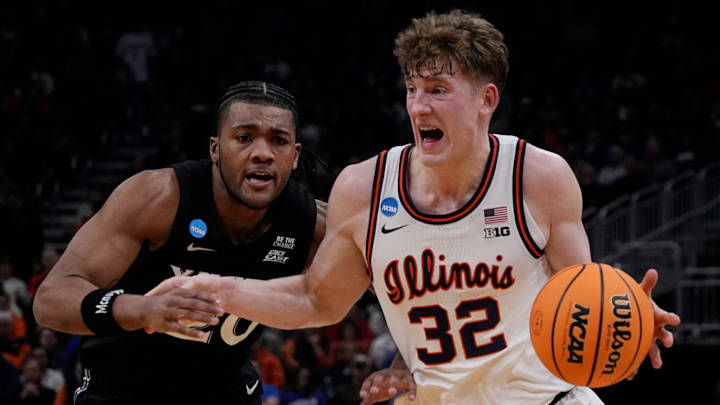 Illinois guard Kasparas Jakucionis (32) drives up to the basket as Xavier guard Dayvion McKnight (20) attempts to guard him during the second half of their first round NCAA men’ s basketball tournament game on Friday March 21, 2025 at Fiserv Forum in Milwaukee, Wis.