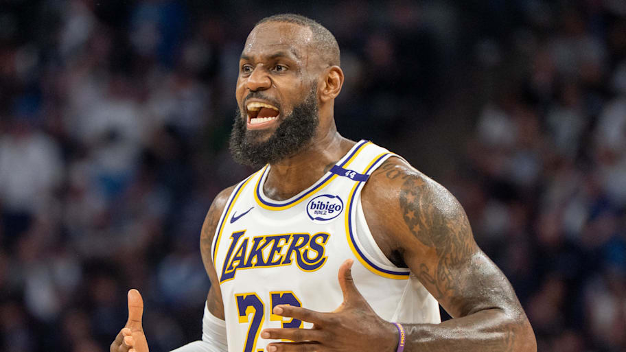 Los Angeles Lakers forward LeBron James (23) talks with his coach during a stoppage in play against the Minnesota Timberwolves in the second quarter during game four of first round for the 2025 NBA Playoffs at Target Center. | Matt Blewett-Imagn Images