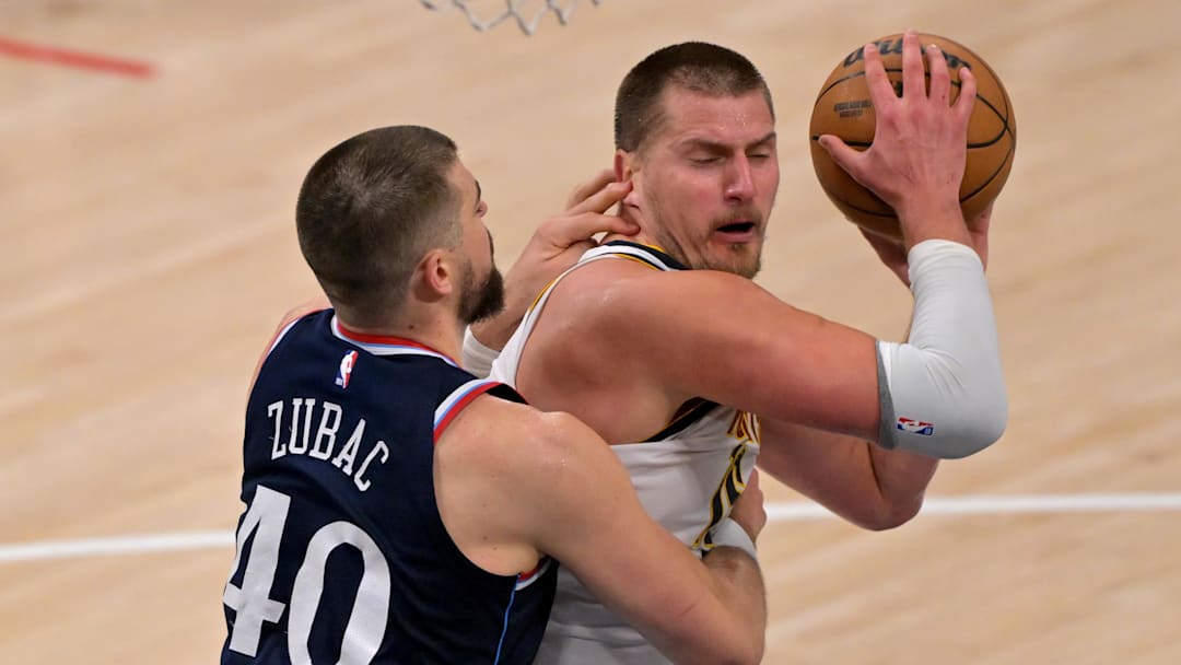 Apr 26, 2025; Inglewood, California, USA;  Los Angeles Clippers center Ivica Zubac (40) defends Denver Nuggets center Nikola Jokic (15) in the second half of game four of round one of the 2024 NBA Playoffs at Intuit Dome. Mandatory Credit: Jayne Kamin-Oncea-Imagn Images
