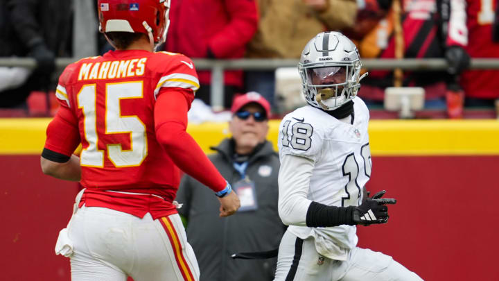 Raiders cornerback Jack Jones returns an interception for a touchdown against Chiefs quarterback Patrick Mahomes during the first half at Arrowhead Stadium.