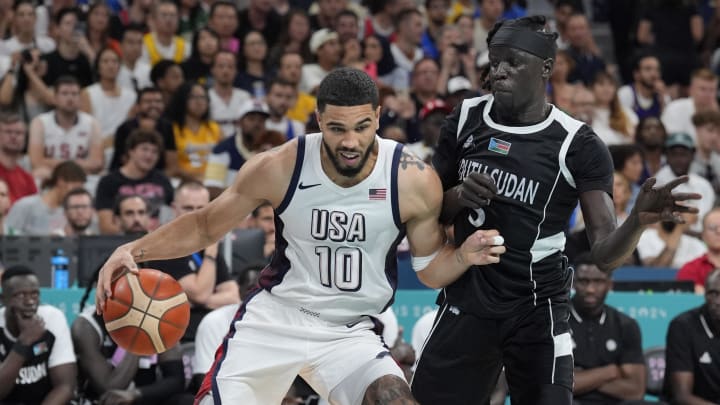 United States small forward Jayson Tatum (10) drives against South Sudan small forward Nuni Omot (5) in the fourth quarter during the Paris 2024 Olympic Summer Games at Stade Pierre-Mauroy.  