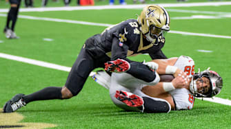 Oct 13, 2024; New Orleans, Louisiana, USA; Tampa Bay Buccaneers tight end Cade Otton (88) scores a touchdown against New Orleans Saints safety Johnathan Abram (24) during the fourth quarter at Caesars Superdome. Mandatory Credit: Matthew Hinton-Imagn Images