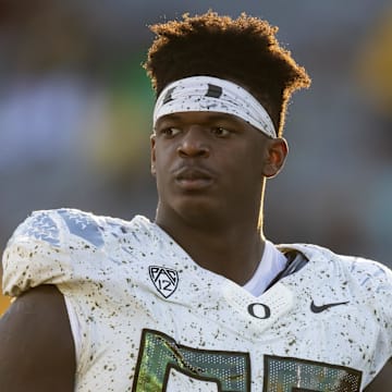 Nov 18, 2023; Tempe, Arizona, USA; Oregon Ducks offensive lineman Marcus Harper II (55) against the Arizona State Sun Devils at Mountain America Stadium. Mandatory Credit: Mark J. Rebilas-Imagn Images